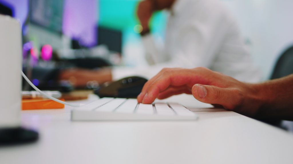 Person using adobe products on the computer